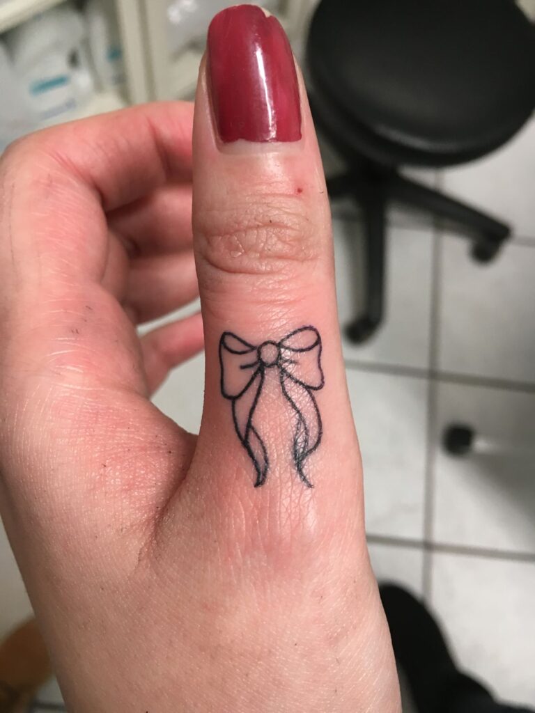 bow hand tattoo