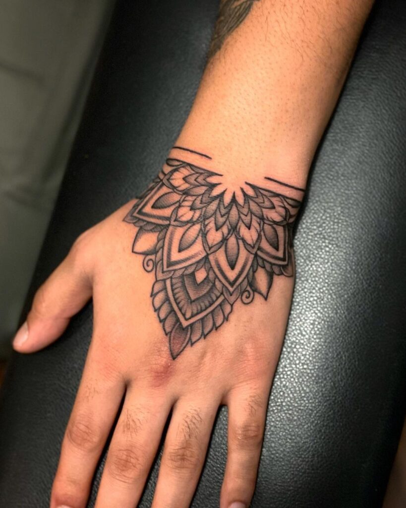 mandala hand tattoo