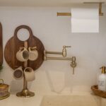 A modern kitchen setup with wooden kitchenware and stylish accessories, perfect for contemporary interiors.